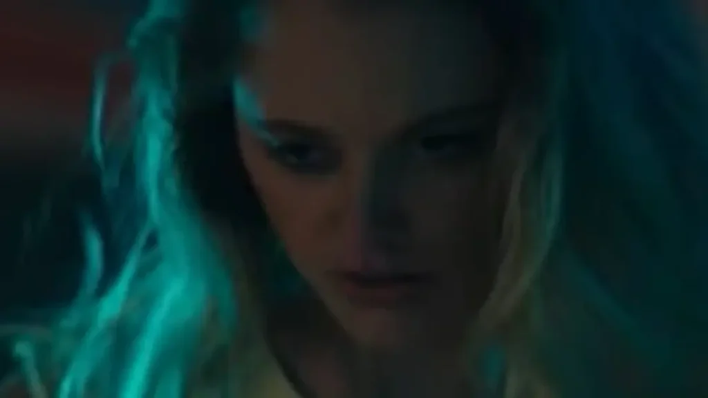 Blood Covenant 2026 trailer scene showing a tense, atmospheric close-up in low light