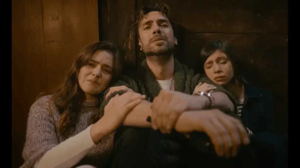 Adil sitting with Eleni and Fadime in an emotional moment from Taşacak Bu Deniz
