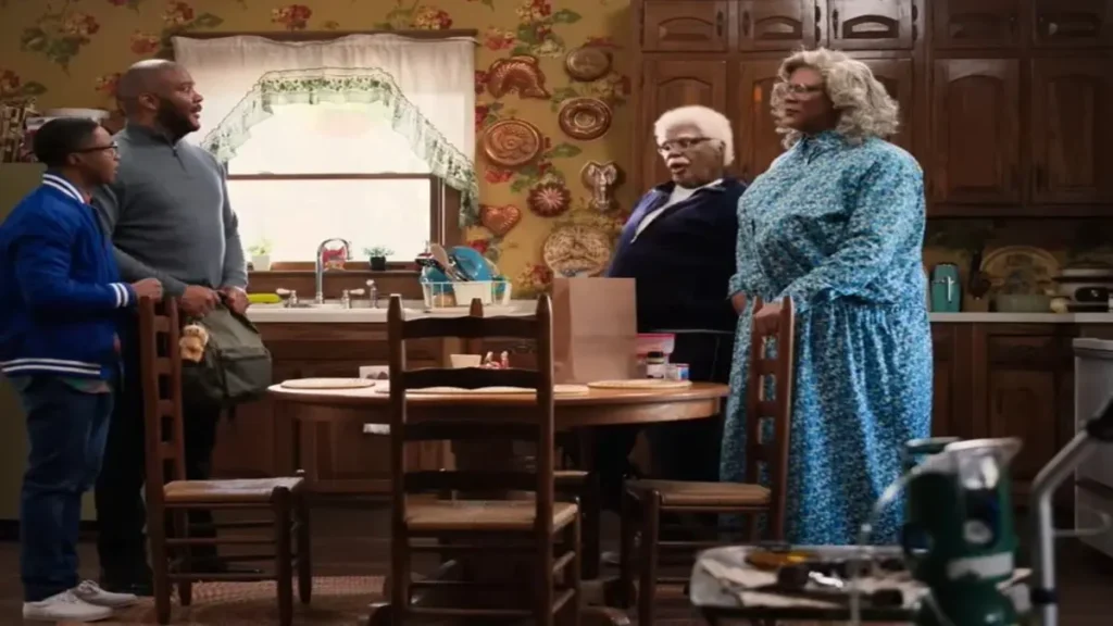 Joe’s College Road Trip Review: A Classic Tyler Perry Comedy. Tyler Perry as Joe arguing with family during a chaotic kitchen scene in Joe’s College Road Trip on Netflix