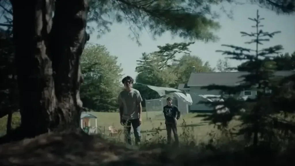 At the Place of Ghosts 2026 trailer scene showing two boys in eerie backyard setting