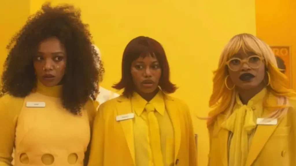 I Love Boosters Trailer Breakdown: A Bold Cinematic Vision Set to Redefine Sci-Fi Satire I Love Boosters trailer scene featuring three women in yellow futuristic setting