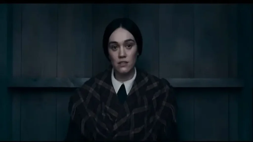 MĀRAMA official trailer scene showing a woman in a dimly lit emotional setting