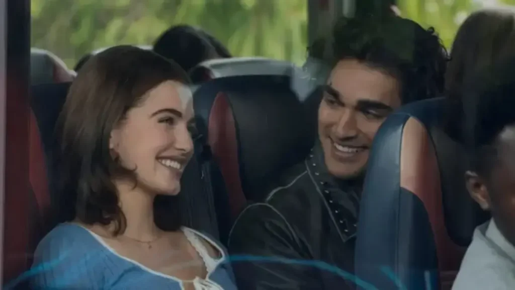 Off Campus teaser scene showing two young adults sharing a moment on a bus