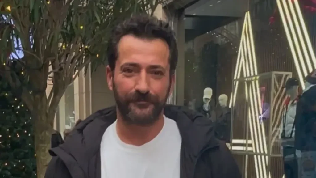 Burç Kümbetlioğlu speaking during a public appearance about his role in Uzak Şehir