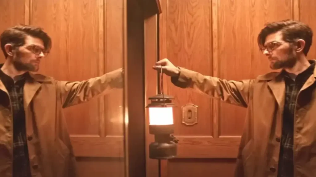 Man holding lantern facing his mirrored reflection in HOKUM 2026 psychological thriller scene