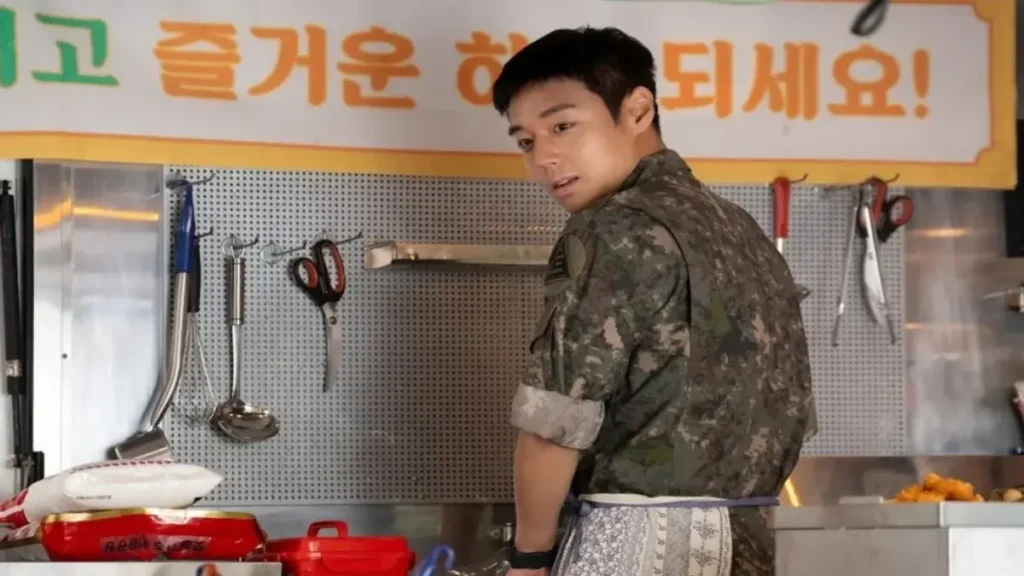 Park Ji Hoon in military uniform cooking in The Legend of Kitchen Soldier 2026 trailer