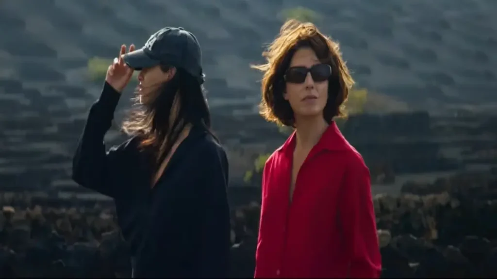 Two women standing outdoors in a dramatic scene from Bitter Christmas (2026) official US teaser.