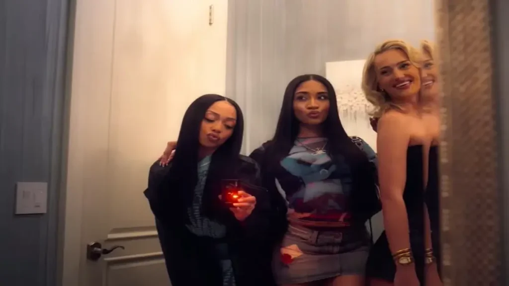 Three stylish young women posing in a mirror selfie scene from Netflix’s Calabasas Confidential trailer.