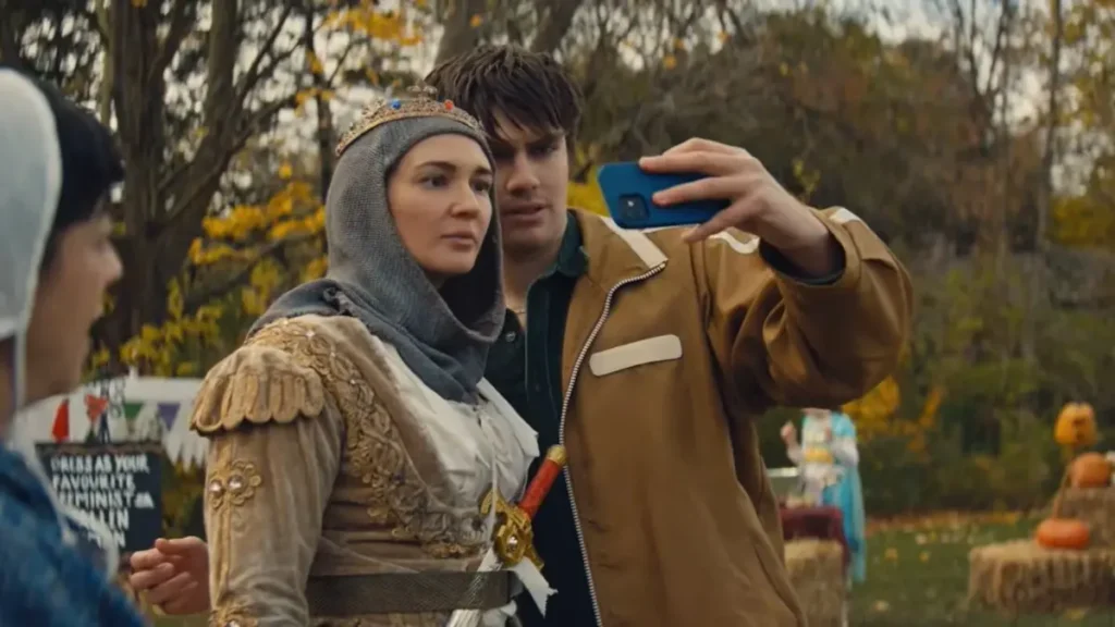 Woman in medieval costume taking a selfie in Pioneer Girl (2026) official trailer scene