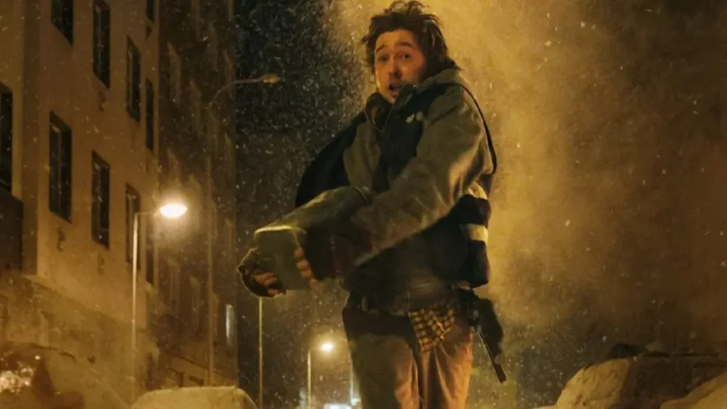Resident Evil teaser scene showing a man running through a snowy street in a tense survival moment
