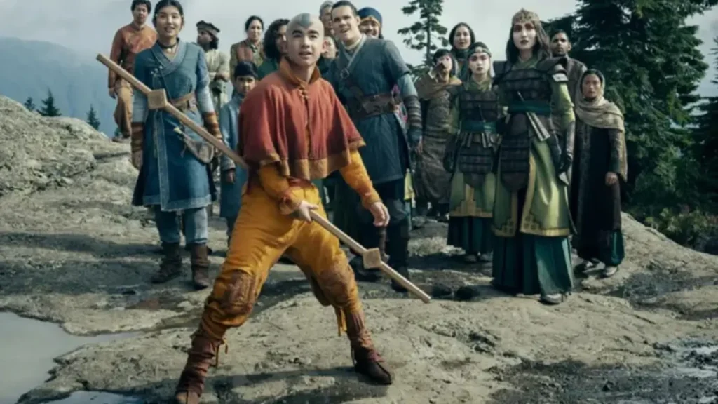 Aang stands ready with his staff in Netflix’s Avatar The Last Airbender Season 2 trailer surrounded by Earth Kingdom allies.