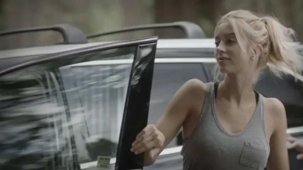 Sabina Gadecki appears in a tense scene from the Capps Crossing: Wrong Side of Dead (2026) official trailer.
