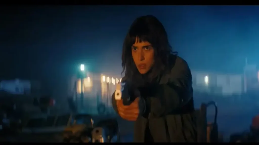 Lead character aiming a handgun in a tense scene from A24's Onslaught official trailer