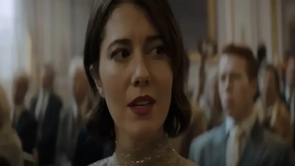 Woman reacting during a tense scene in Rich Flu (2026) official trailer.