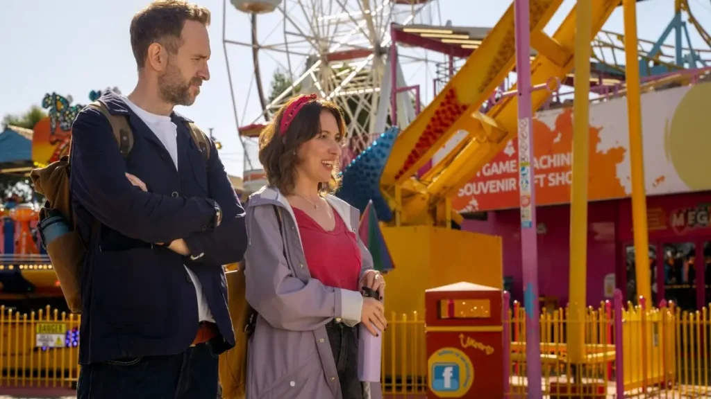Trying Season 5 official trailer scene featuring Nikki and Jason at an amusement park on Apple TV+